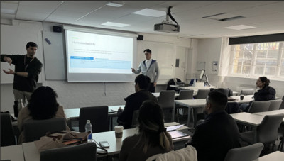 Dr Jae-Hwan Park and Davide Carta delivering the economics workshop