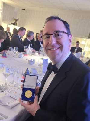 James showing off his medal at the IOM3 celebration dinner