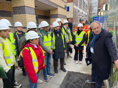 Gerry Ackerman shows students around the site