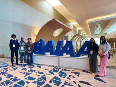 The students at the entrance to the conference hall