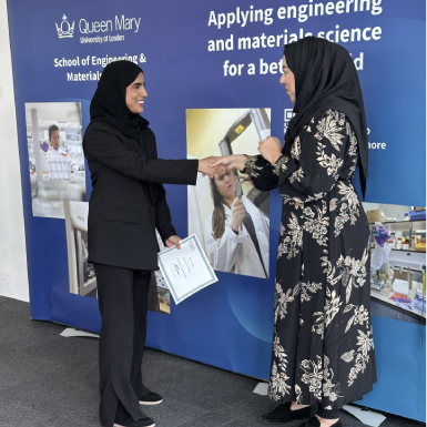 click/tap to enlarge this image... Teha Al-Thani shaking hands with Dr Sanaa Hafeez