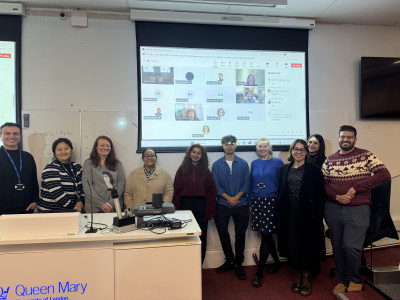 Staff present to receive their awards included in the front row from left to right: Giuseppe, Chelsea, Helen, Mouna, Priyanka, Nabil, Hazel (HOS), Ana, Nasima & Kshitij. In Hybrid mode on the Big Screen behind: Li, Doug & Joanna.